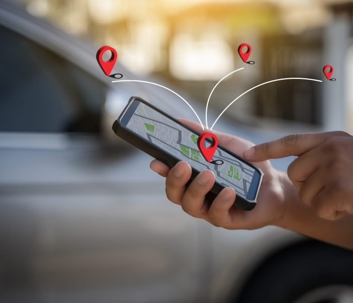A man makes use of GPS and the internet. online map in the car controls the navigator for GPS tracking.
